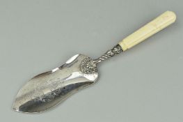 A 19TH CENTURY WHITE METAL IVORY HANDLED FISH SLICE, engraved blade, shell and scroll decoration,