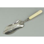 A 19TH CENTURY WHITE METAL IVORY HANDLED FISH SLICE, engraved blade, shell and scroll decoration,