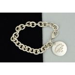 A TIFFANY & CO. SILVER BRACELET, the belcher link bracelet suspending a circular panel stamped '