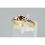 A MODERN RUBY AND DIAMOND THREE STONE RING, ring size N, stamped '18ct', approximate gross weight
