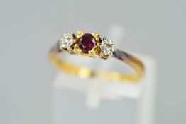 A MODERN RUBY AND DIAMOND THREE STONE RING, ring size N, stamped '18ct', approximate gross weight