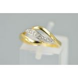 A 9CT GOLD DIAMOND DRESS RING, designed as three curved lines, the central line set with four single