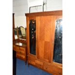 AN EDWARDIAN MAHOGANY TWO PIECE BEDROOM SUITE comprising of a double mirror door wardrobe above