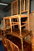 A SET OF SIX OAK ARTS AND CRAFTS RUSH SEATED CHAIRS