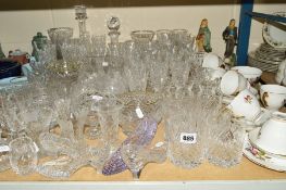 A LARGE PARCEL OF CUT GLASS etc to include drinking glasses, decanters, rose bowls, vases and