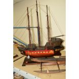 A SCRATCH BUILT MODEL OF A PORTUGESE MAN O'WAR BOAT, approximate height 82cm, together with a