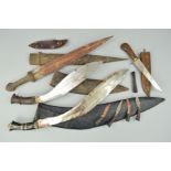 A SMALL ACCUMULATION OF ASIAN/MIDDLE EASTERN/ARABIC SHORT SWORDS AND DAGGERS, a short sword,