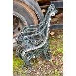 A SET OF DARK GREEN PAINTED METAL BENCH ENDS with scrolled design and small lion face to front (4)