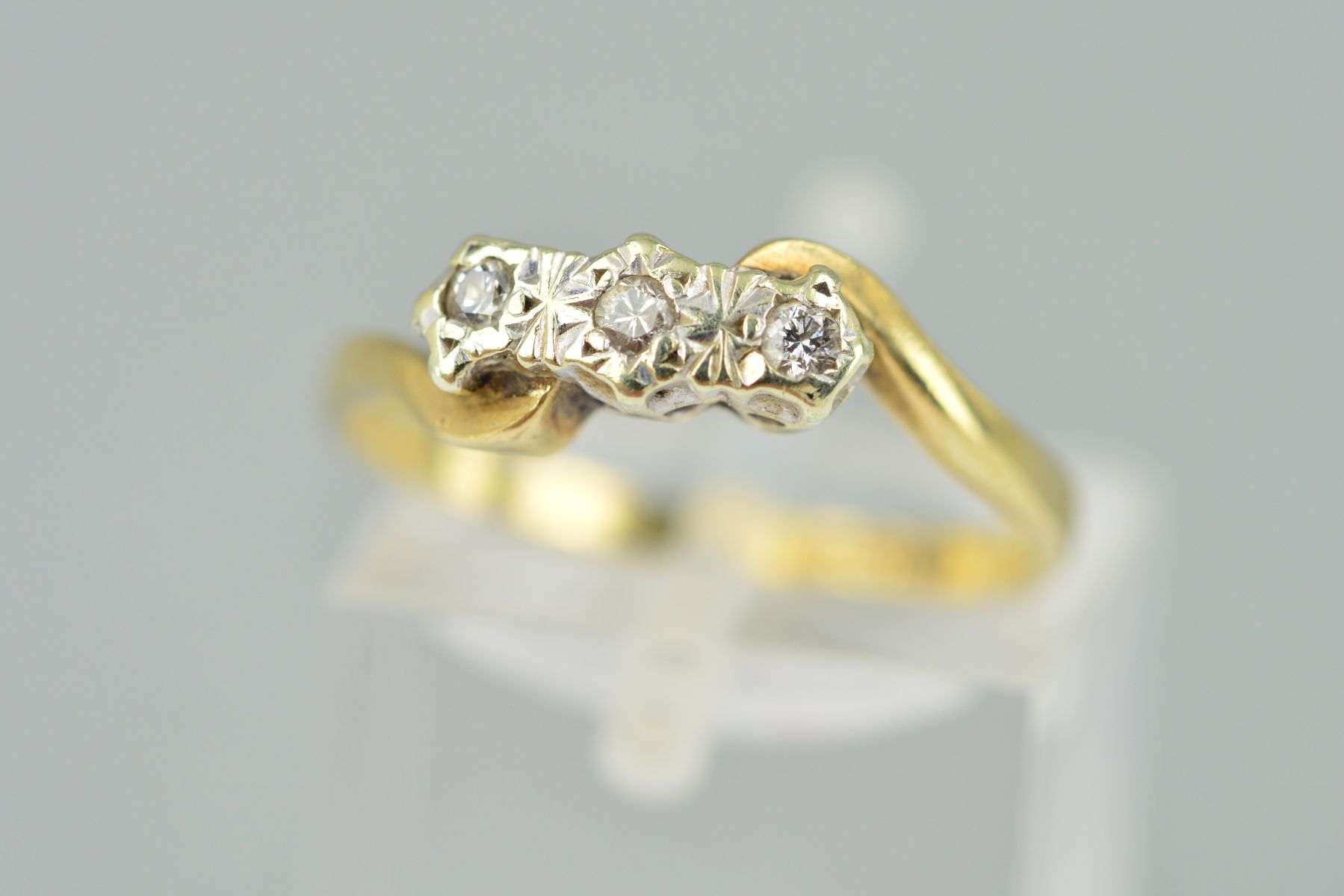 A 9CT GOLD THREE STONE DIAMOND RING, the three brilliant cut diamonds with illusion settings to - Image 2 of 2