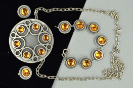 A SUITE OF DANISH BENT LARSEN TIN JEWELLERY to include a pendant necklace, the pendant of circular