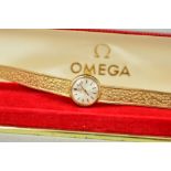 A 9CT GOLD LADY'S OMEGA WRISTWATCH WITH MAKERS CASE, the circular face with baton hour markers to