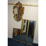 A MODERN FOLIATE GILT FRAMED WALL MIRROR, two rectangular wall mirrors and another mirror (4)