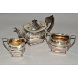 A LATE VICTORIAN SILVER THREE PIECE TEASET, of shaped oval form, gadrooned rims, banded and