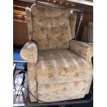 AN ELECTRIC READING CHAIR (situated near lot 1209)