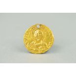 A BYZANTINE GOLD COIN 900-950 AD, Obverse, the bust of the Christ wearing nimbus cruciger, pellets