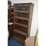 AN OAK GLOBE WERNICKE FIVE SECTION BOOKCASE with glazed fall front doors, approximate width 87cm x