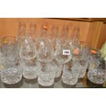 A SUITE OF CUT GLASSES, to include six flutes, eight brandy, six large tumblers and five smaller