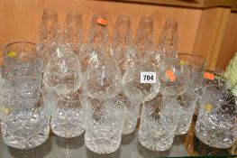 A SUITE OF CUT GLASSES, to include six flutes, eight brandy, six large tumblers and five smaller
