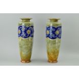 A PAIR OF ROYAL DOULTON STONEWARE VASES, applied floral and beaded decoration, impressed backstamp