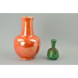 A RUSKIN POTTERY VASE OF BULBOUS FORM, orange lustre glaze, stamped to base Ruskin England 1923,