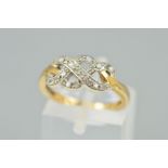 A 9CT GOLD DIAMOND DRESS RING, the interlinking design set with single cut diamonds, with 9ct