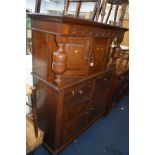 AN EARLY 20TH CENTURY OAK COURT CUPBOARD with two drawers on casters, width 127cm x depth 47cm x