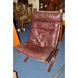 INGMAR RELLING FOR WESTNOFA NORWAY, a siesta chair with burgundy leather on a wooden frame (label to