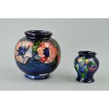 TWO MOORCROFT POTTERY VASES, a bulbous 'Anemone' pattern on blue ground, impressed marks and painted