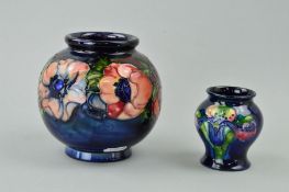 TWO MOORCROFT POTTERY VASES, a bulbous 'Anemone' pattern on blue ground, impressed marks and painted