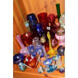 A GROUP OF COLOURED GLASSWARES, to include Phoenician glass vase and paperweight, vaseline glass bud
