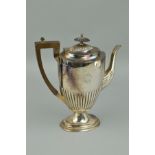 A GEORGE V SILVER COFFEE POT OF OVAL FORM, stop reeded decoration, engraved monogram, makers
