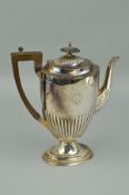 A GEORGE V SILVER COFFEE POT OF OVAL FORM, stop reeded decoration, engraved monogram, makers