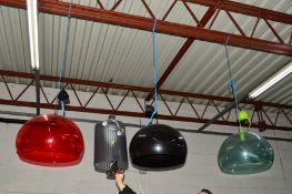 KARTELL, ITALY, a set of three FL/Y transparent pendant light in green, black and red (with one
