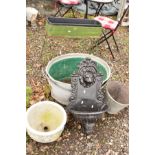 A METAL PLANTER ON A STAND, two galvanised bath tubs and a bucket, a painted metal water feature