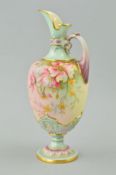 A ROYAL WORCESTER PEDESTAL EWER, shape No 1581, florally decorated with gilt edging, puce