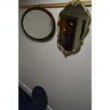 AN EDWARDIAN OVAL MAHOGANY BEVELLED EDGE WALL MIRROR, a foliate framed wall mirror and a circular