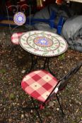 A CIRCULAR CONTINENTAL TILE TOP GARDEN TABLE, together with a matching pair of folding chairs (3)