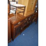 AN EDWARDIAN WALNUT SIDEBOARD with three various drawers, width 181cm x depth 52cm x height 95cm