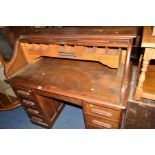 A 20TH CENTURY OAK ROLL TOP DESK with eight various drawers, approximate width 122cm x depth 66cm