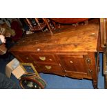 A REPRODUCTION GEORGIAN STYLE OAK SIDEBOARD with two short drawers raised on turned legs united by a