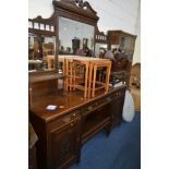 AN EDWARDIAN OAK MIRROR BACK SIDEBOARD with three various drawers and double panelled doors,