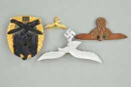 A NUMBER OF GERMAN WWII ITEMS, to include a close combat badge '75' (copy), small gold coloured