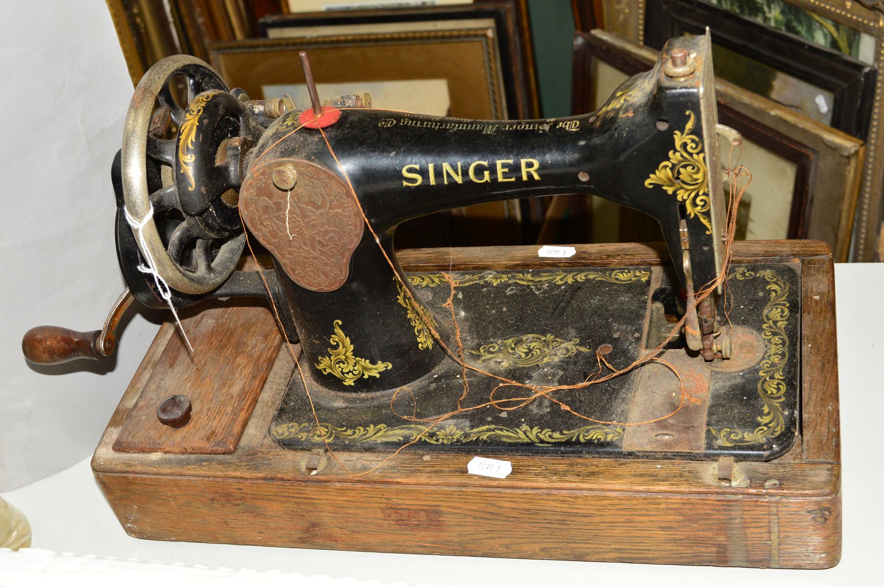 A SINGER TABLE TOP SEWING MACHINE