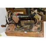 A SINGER TABLE TOP SEWING MACHINE