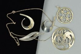 FOUR ITEMS OF DESIGNER JEWELLERY to include a circular openwork pendant by Ola M Gorie, length 54mm,