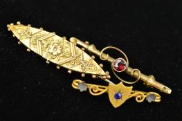 THREE LATE 19TH TO EARLY 20TH CENTURY 9CT GOLD BROOCHES, the first designed with a central shield