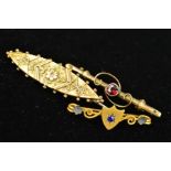 THREE LATE 19TH TO EARLY 20TH CENTURY 9CT GOLD BROOCHES, the first designed with a central shield