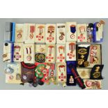 A LARGE BOX CONTAINING A LARGE NUMBER OF MEDALS, BADGES AND AWARDS TO VARIOUS MEMEBERS OF THE