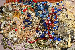 A SELECTION OF COSTUME JEWELLERY, mainly necklaces to include a long bone bead necklace, a