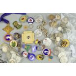 A PLASTIC BOX OF SILVER COINS, BADGES, etc, with sterling and .500 silver of UK coinage to include